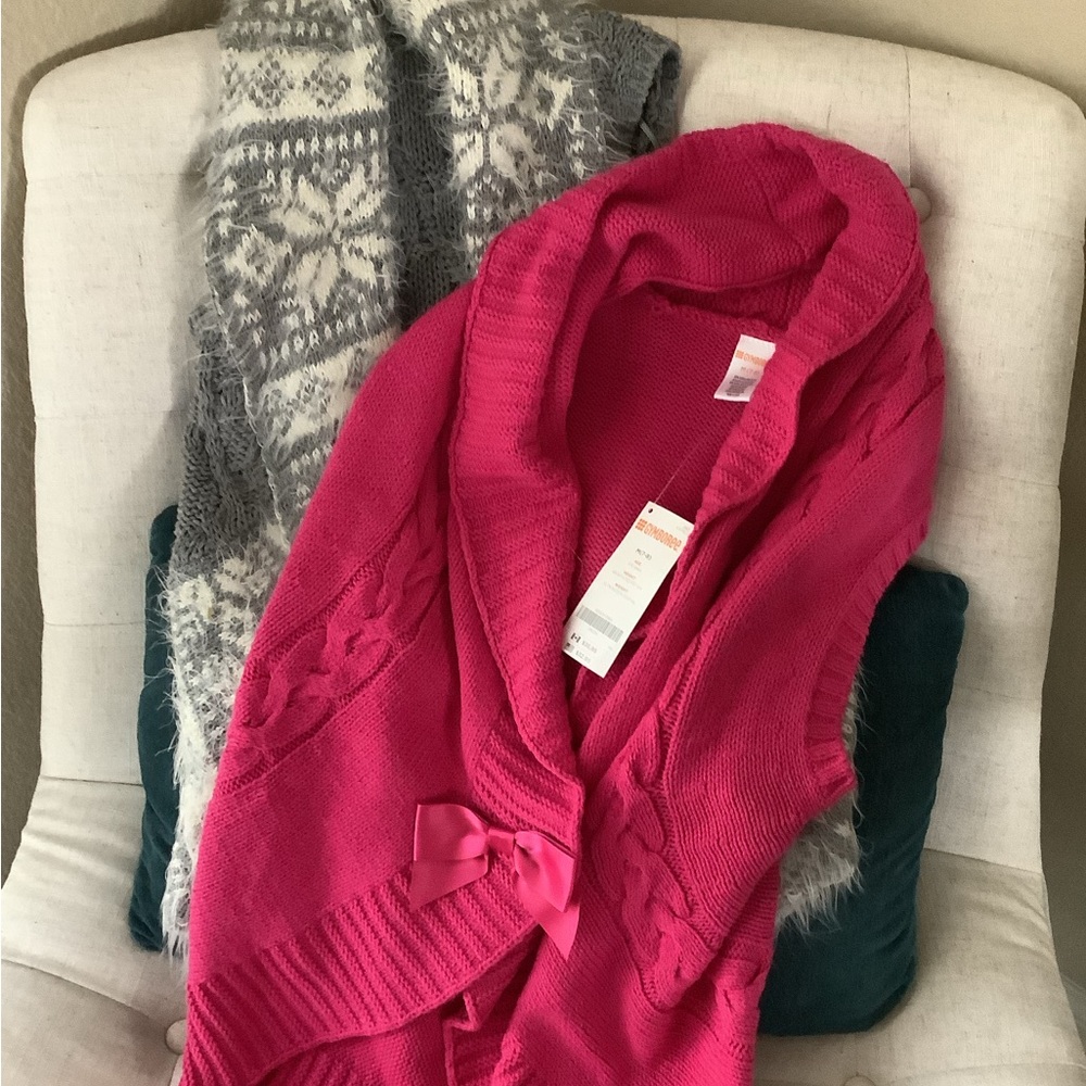 Two Sleeveless sweater vest, girls size 7-8.